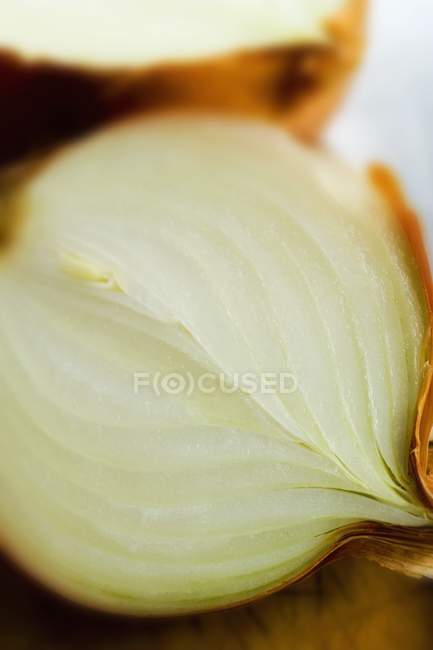 Halved onion on the table — Stock Photo