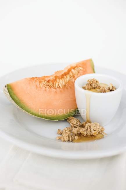 Yoghurt with muesli and honey — Stock Photo