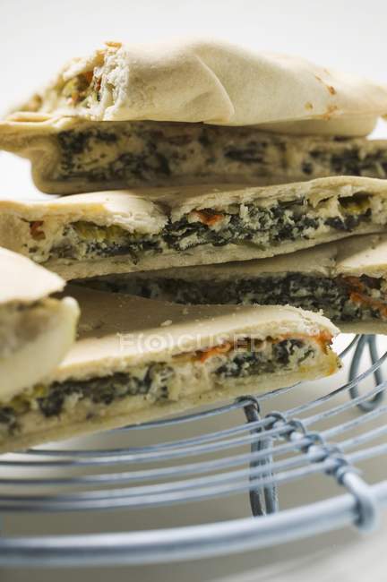 Pieces of spinach and pie — Stock Photo