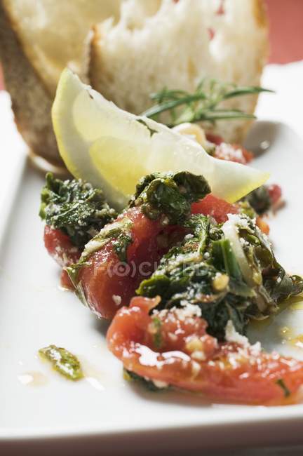 Chard and tomatoes with lemon — Stock Photo