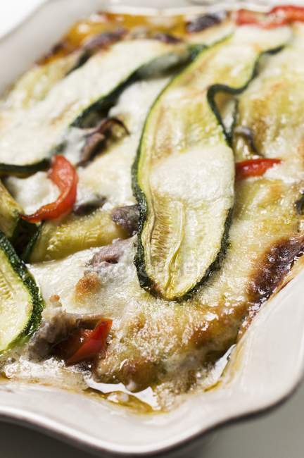 Pepper and courgette gratin on plate — Stock Photo
