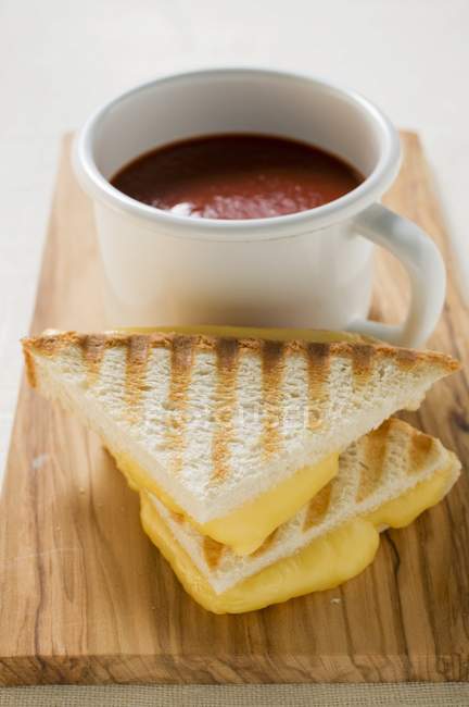 Toasted cheese sandwiches and tomato soup — Stock Photo