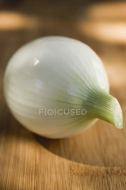 Spring onion on wooden background — Stock Photo