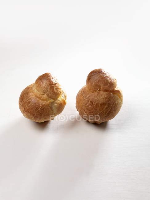 Closeup view of two Brioches on white surface — Stock Photo