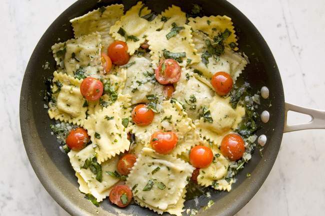 Tomato and basil ravioli pasta — Stock Photo