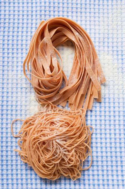 Homemade red ribbon pasta — Stock Photo