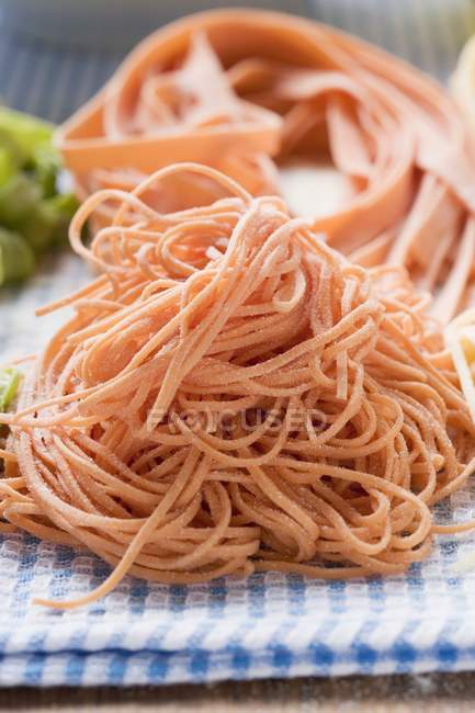 Red spaghetti and ribbon pasta — Stock Photo
