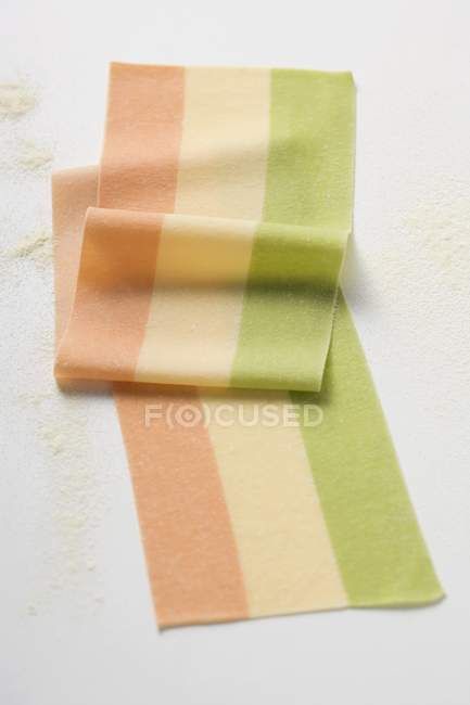 Homemade three-colour lasagne sheet — Stock Photo