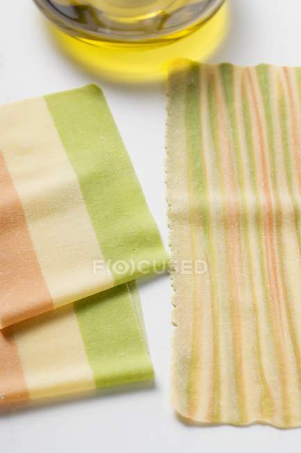 Homemade three-colour lasagne sheets — Stock Photo