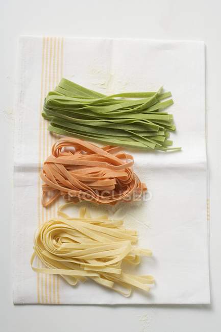 Homemade coloured ribbon pasta — Stock Photo