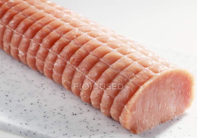 Raw Pork chops tied with rope — Stock Photo
