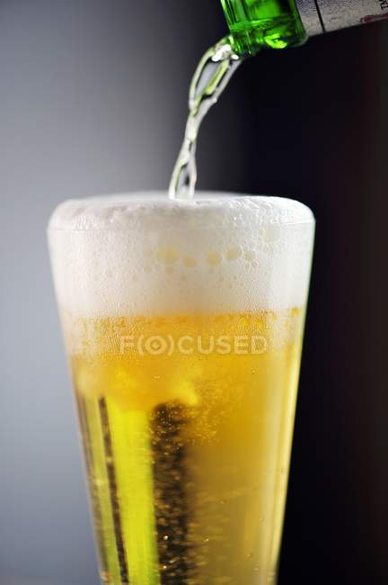Beer being poured — Stock Photo