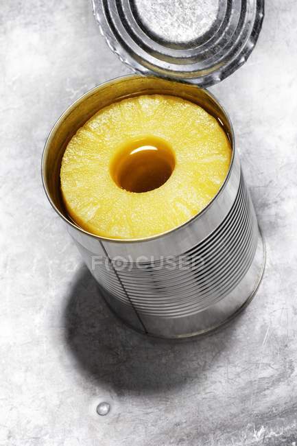 Pineapple rings in tin — Stock Photo
