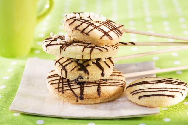 Biscuits on wooden sticks — Stock Photo