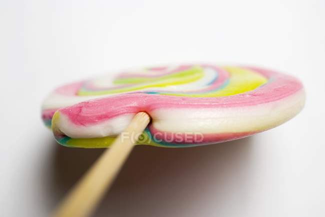 Pastel-coloured lollipop, close-up — Stock Photo
