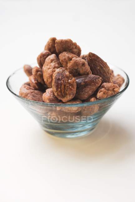 Roasted almonds in glass bowl — Stock Photo