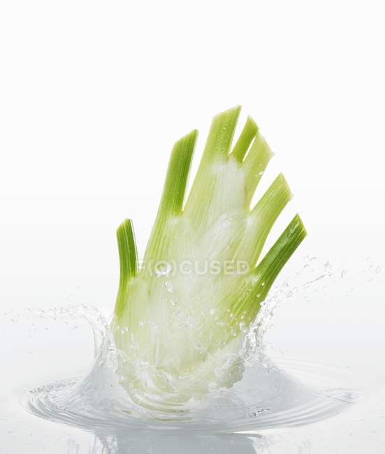 Bulb falling into water — Stock Photo