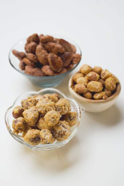 Mixed nuts to nibble in bowls — Stock Photo