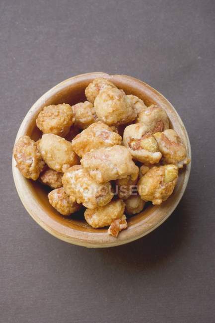 Peanuts to nibble in bowl — Stock Photo