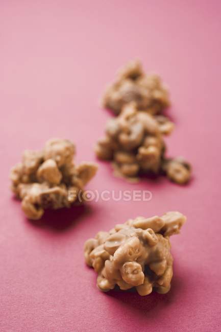 Nut sweets on pink — Stock Photo