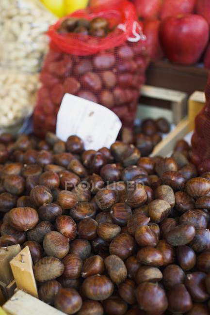 Sweet chestnuts in crates — Stock Photo