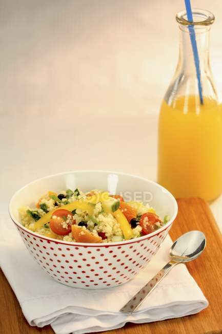 Couscous salad and orange juice — Stock Photo