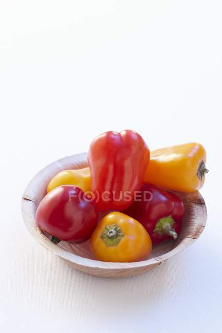 Bell peppers in paper bowl — Stock Photo