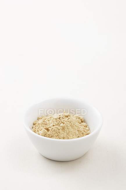 Bowl of ground ginger — Stock Photo