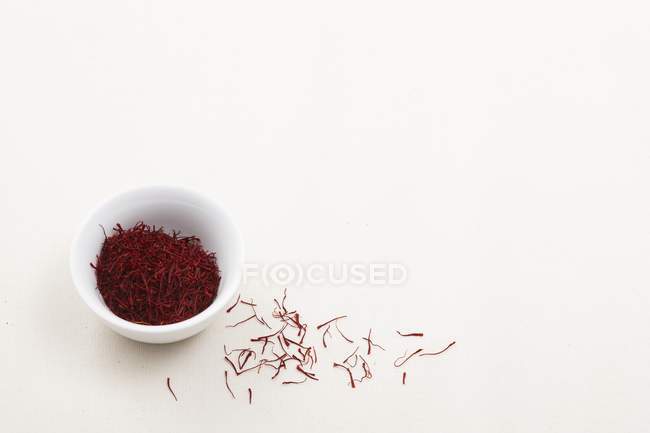 Saffron threads in bowl — Stock Photo