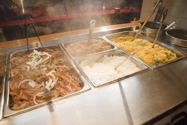 Trays with pulled pork and rices — Stock Photo