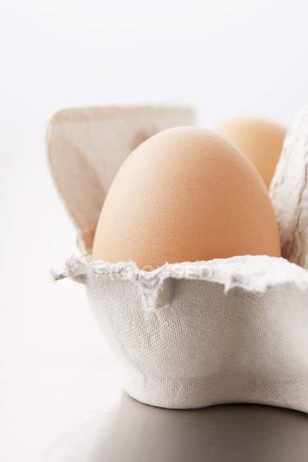 Chicken egg in cardboard box — Stock Photo