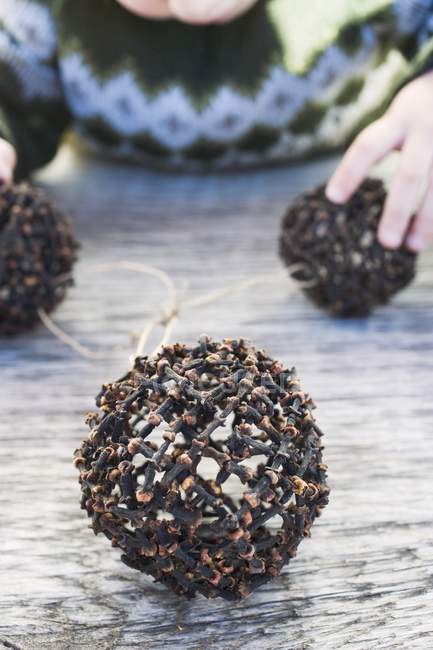 Christmas baubles made of cloves — Stock Photo