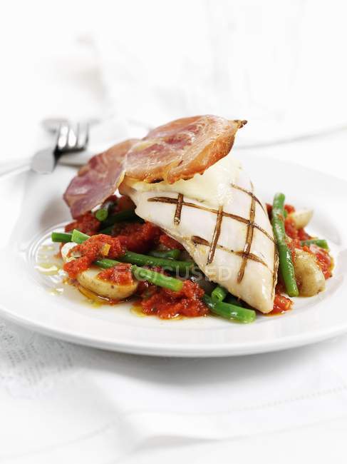 Grilled Chicken breast with Parma ham — Stock Photo