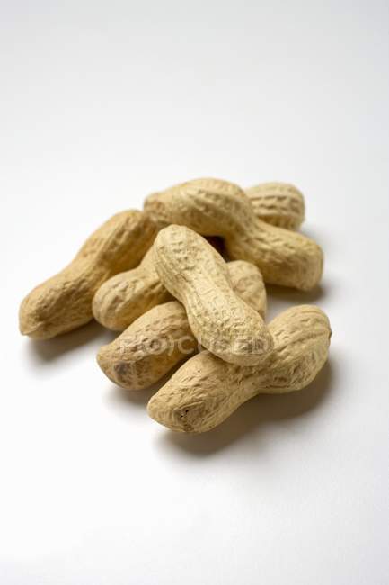 Several raw peanuts — Stock Photo