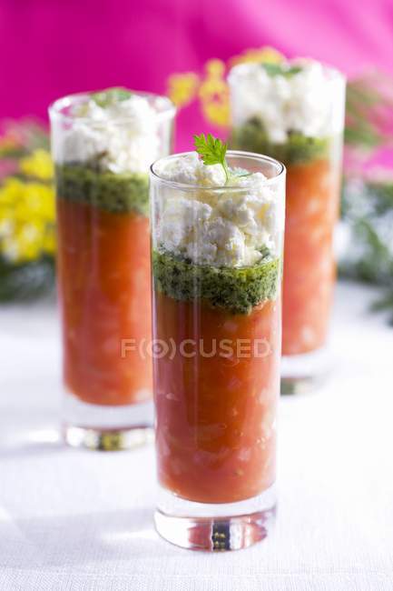 Tomato soup with basil and goats cheese — Stock Photo