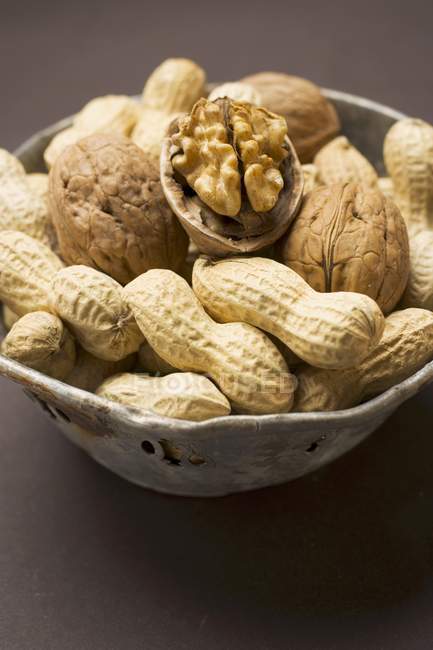 Several peanuts and walnuts — Stock Photo