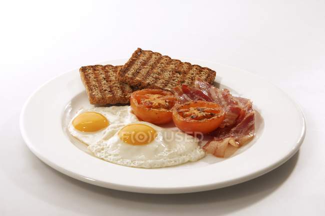 English breakfast with fried egg — Stock Photo