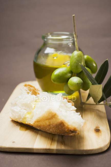 Olive sprig with green olives — Stock Photo