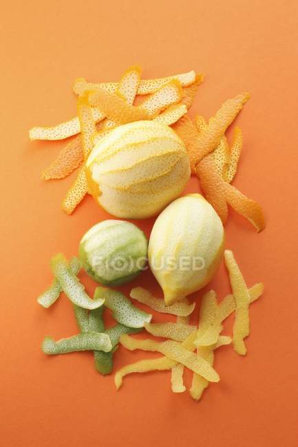Peeled orange with lime — Stock Photo