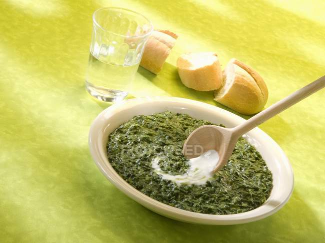 Spinach with sour cream — Stock Photo