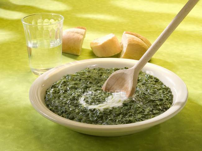 Spinach with sour cream — Stock Photo