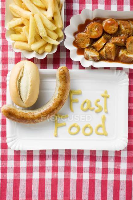 Sausage with bread and chips — Stock Photo