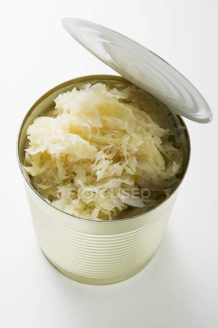 Sauerkraut in metal tin on white background — Stock Photo