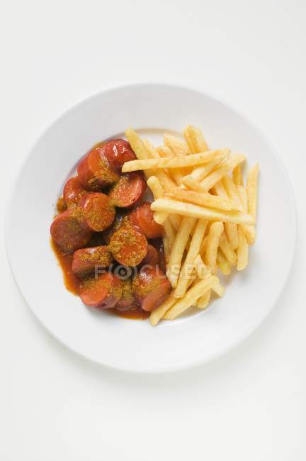 Currywurst mit Ketchup und Currypuder — Stockfoto