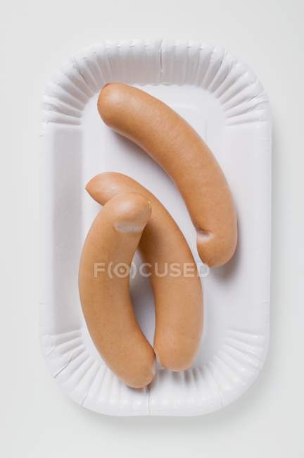 Frankfurters on paper plate — Stock Photo