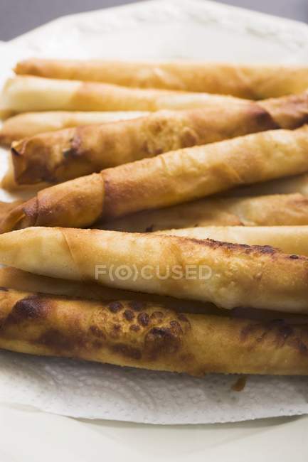 Cigar-shaped pastries — Stock Photo