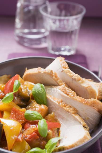 Roasted pork with peppers and herbs — Stock Photo