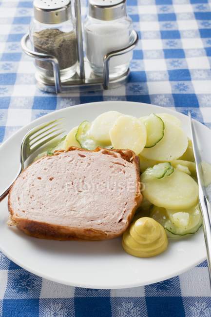 Leberkase and potato and cucumber salad — Stock Photo