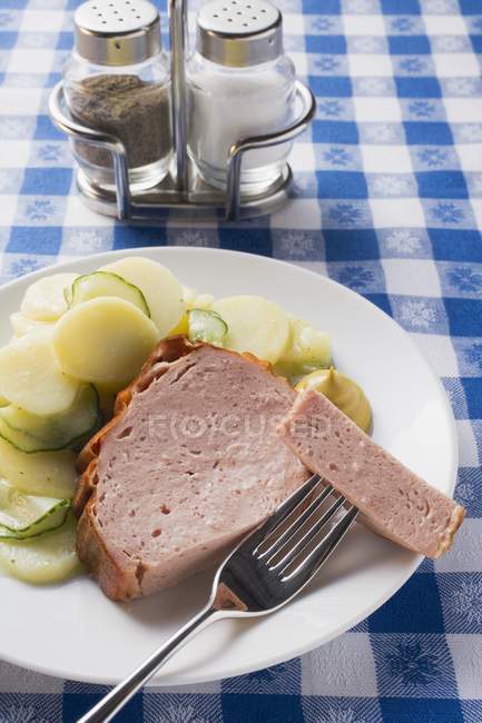 Leberkase and potato and cucumber salad — Stock Photo
