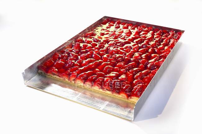 Strawberry cake on baking tray — Stock Photo